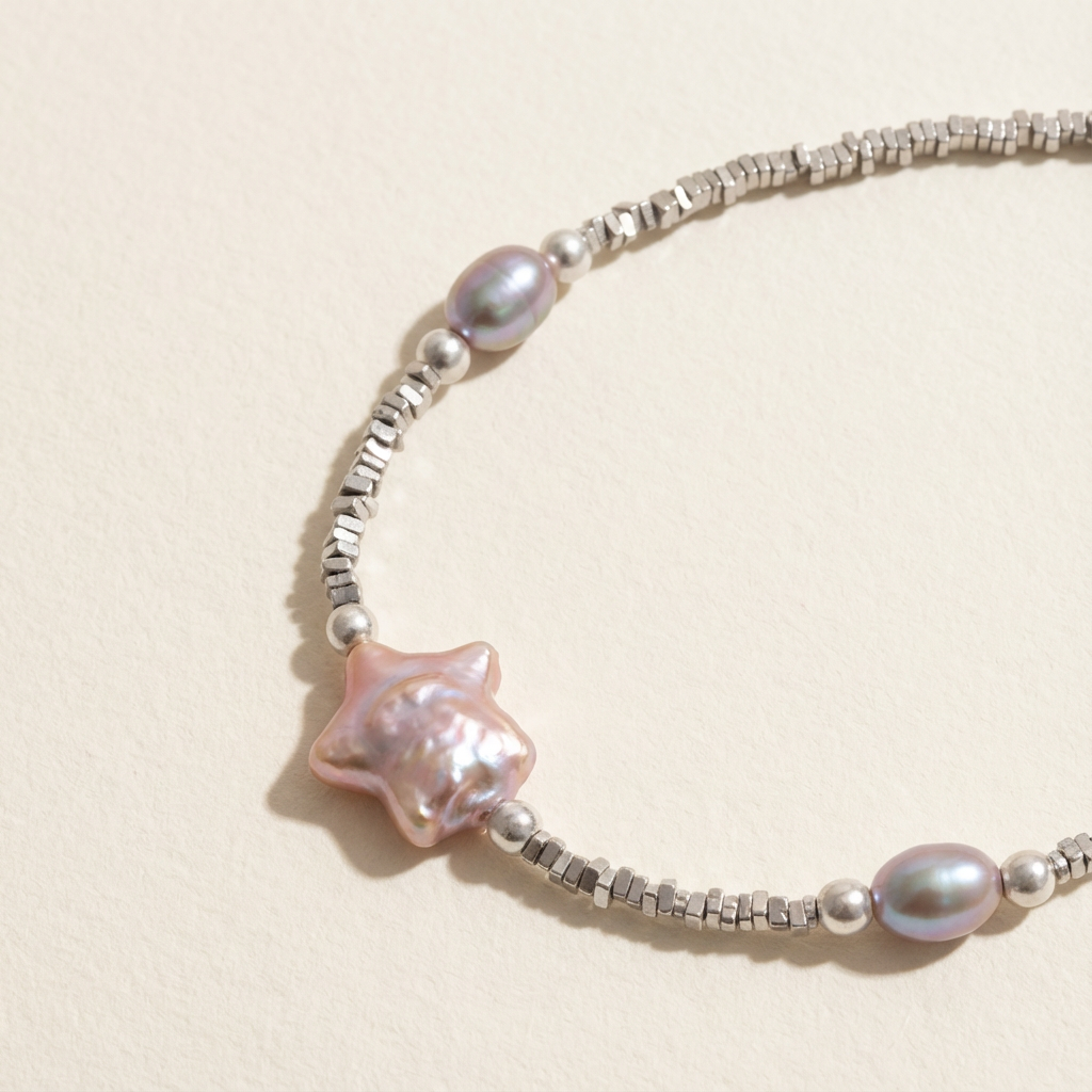 Close-up of The Lavender Star bracelet showing the star charm and lavender baroque pearls