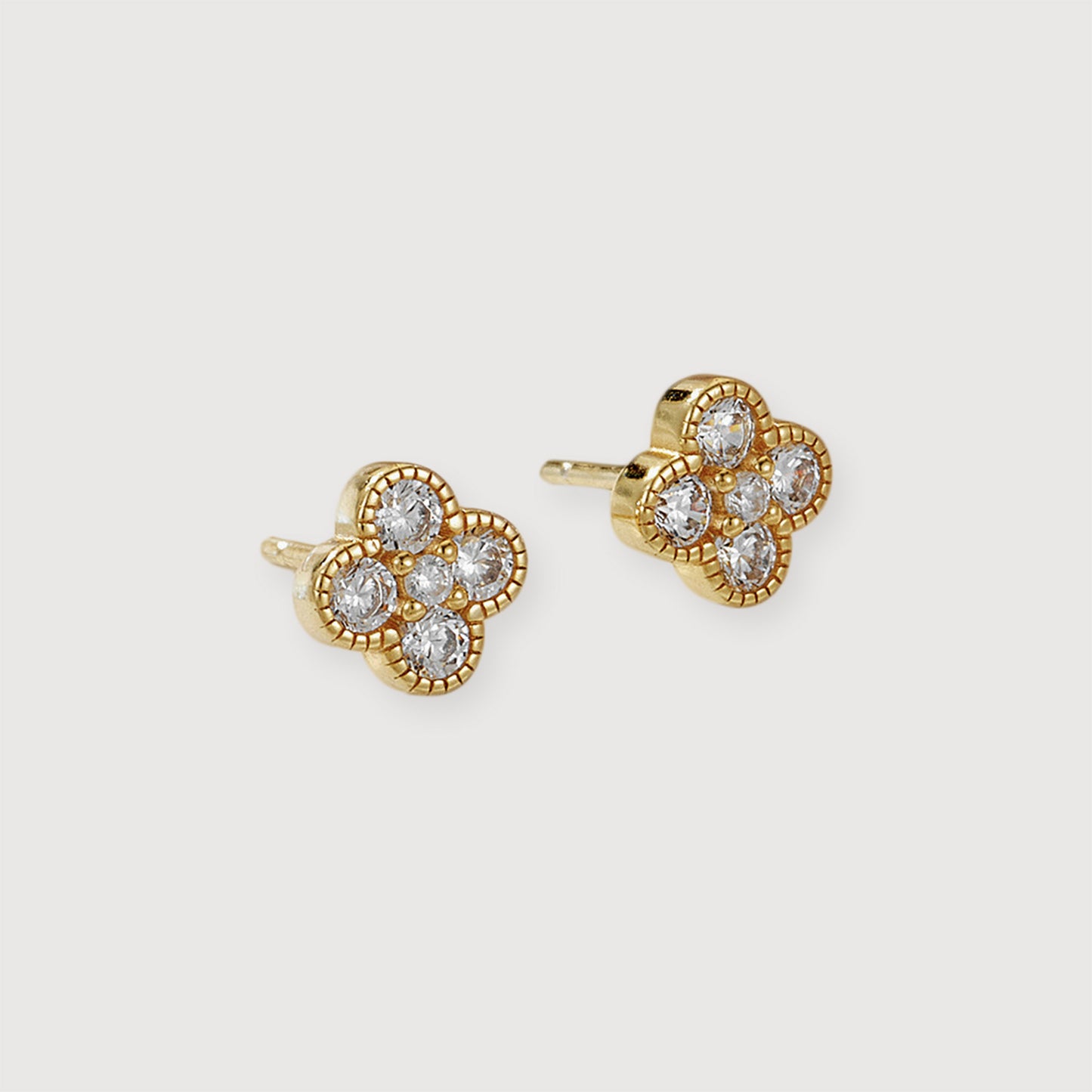 Clover Shine stud earrings in 18K gold-plated finish on a light background