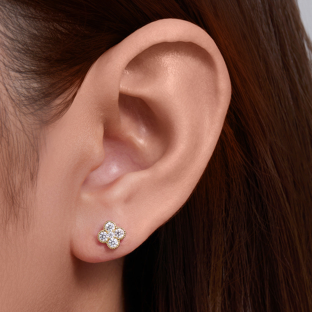 Clover Shine stud earring worn on the ear in 18K gold-plated finish