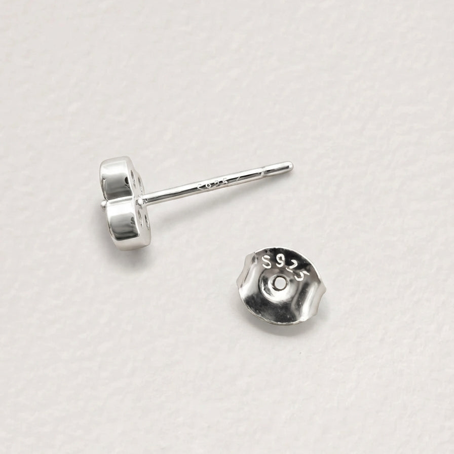 Back view of Clover Shine stud earring in silver finish showing the post and butterfly back