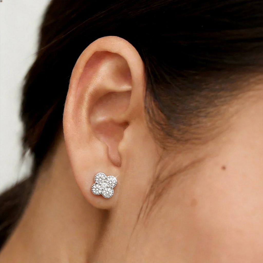 Clover Shine silver stud earring worn on the ear