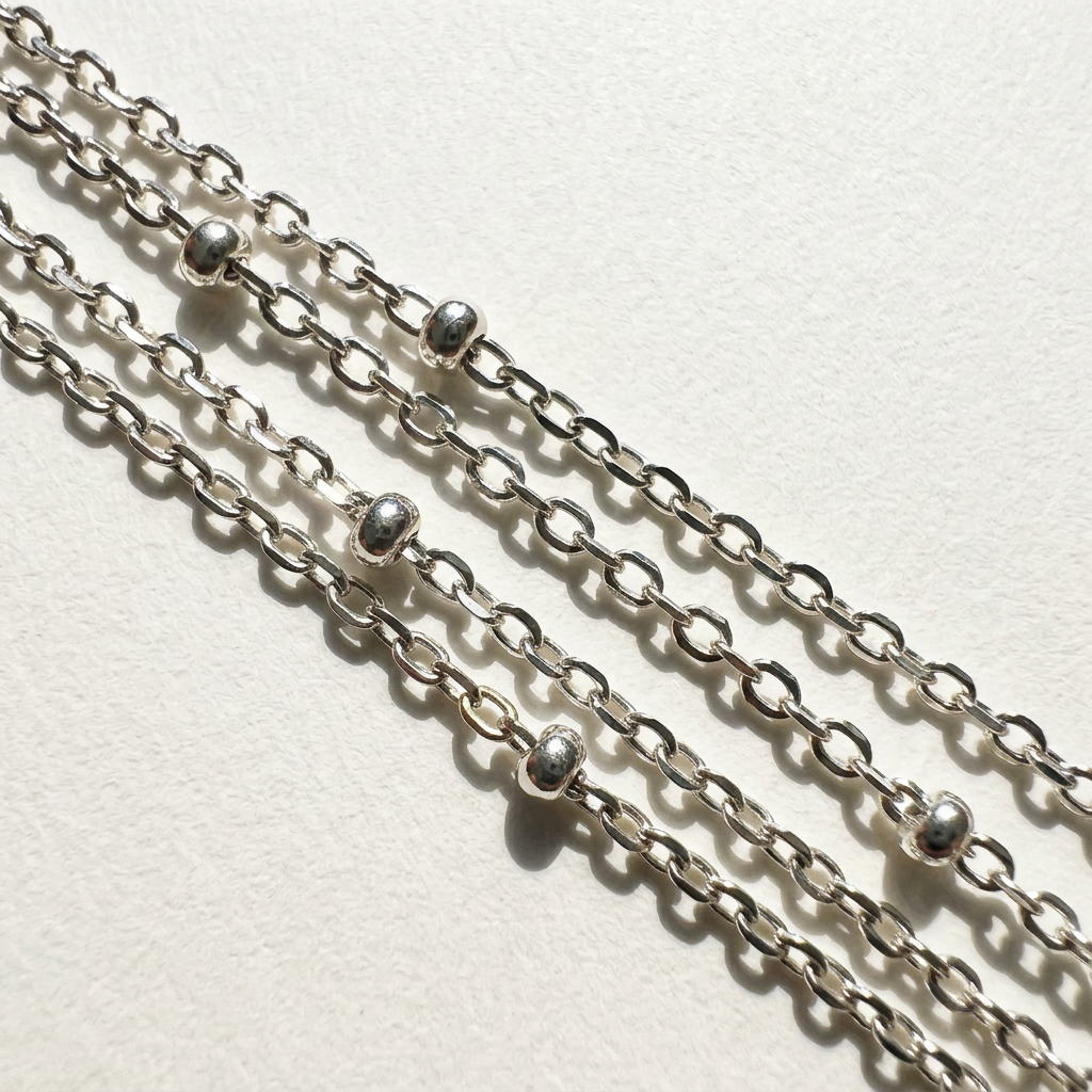 Close-up of the sterling silver chain detail on the star baroque freshwater pearl necklace