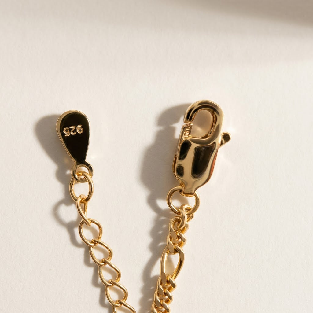 Clasp detail of The Halo Thread freshwater pearl bracelet in 18K gold-plated sterling silver, showing the fastening and extender chain