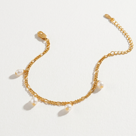 The Halo Thread freshwater pearl bracelet in 18K gold-plated sterling silver with suspended freshwater pearls, shown from above