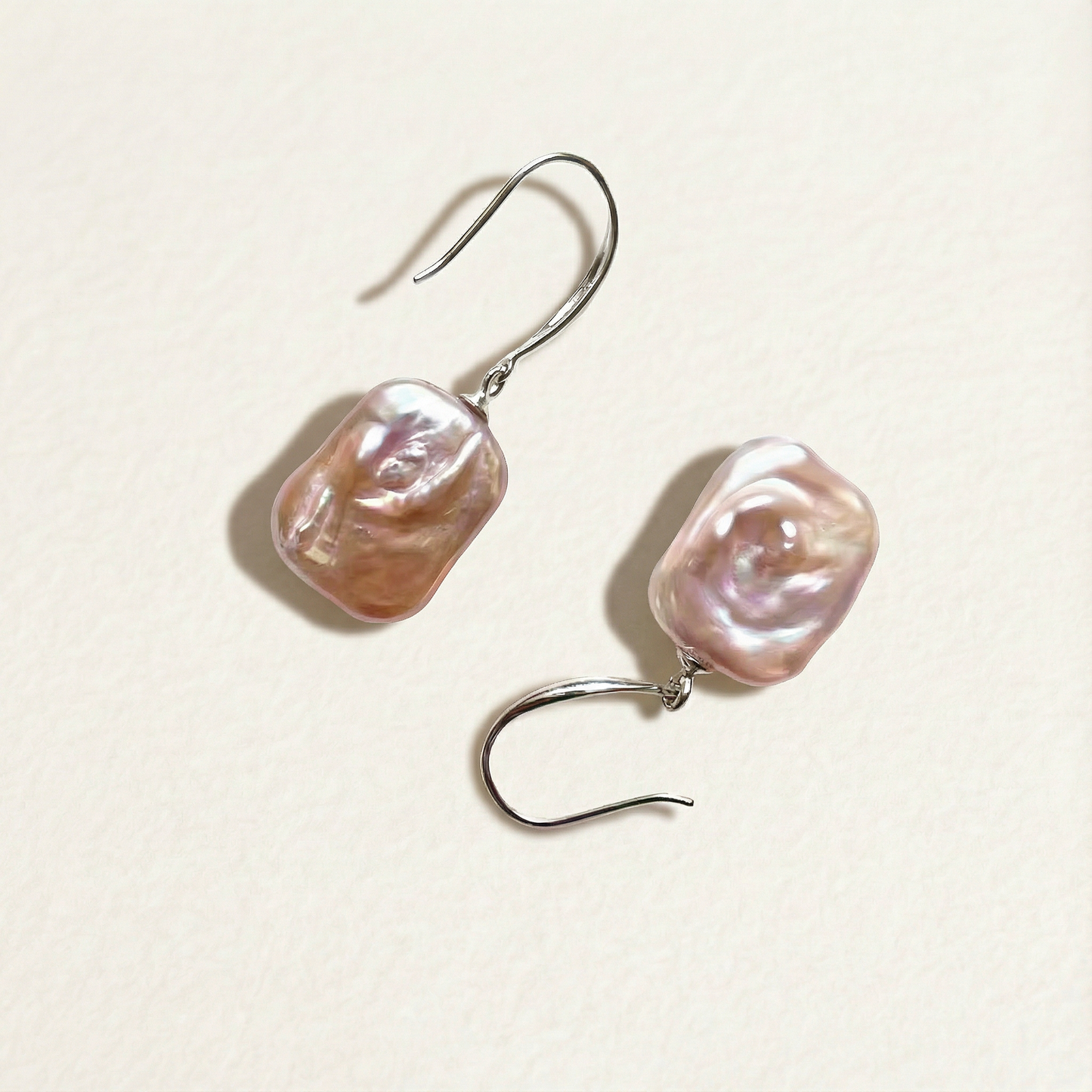The Lavender Geometric baroque pearl drop earrings shown on a light background