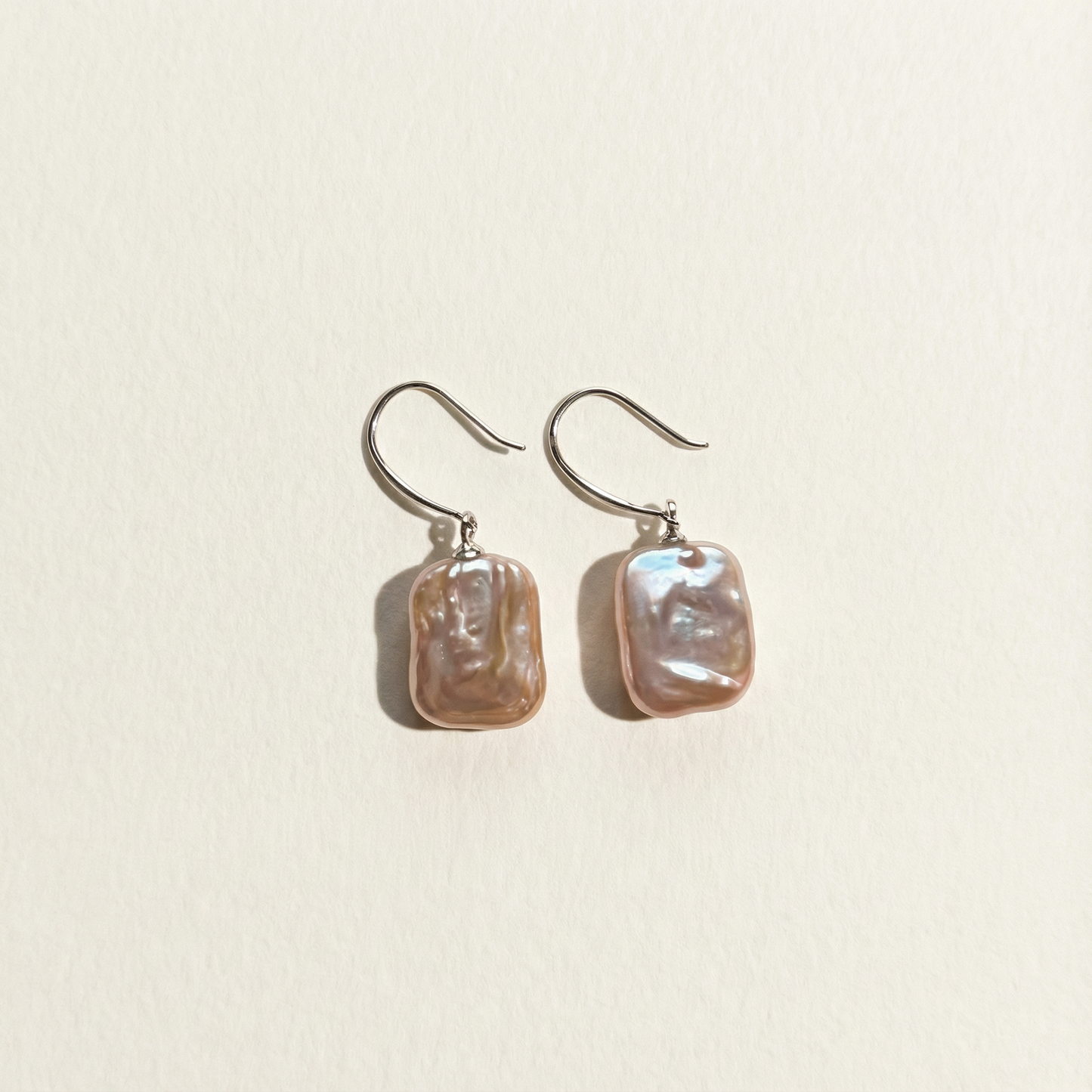 The Lavender Geometric baroque pearl drop earrings shown in full view on a light background