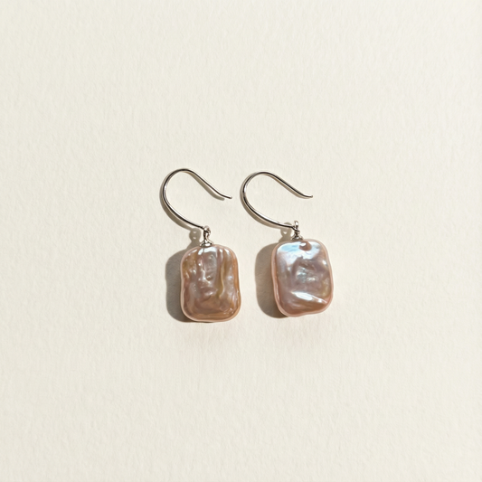 The Lavender Geometric baroque pearl drop earrings shown in full view on a light background
