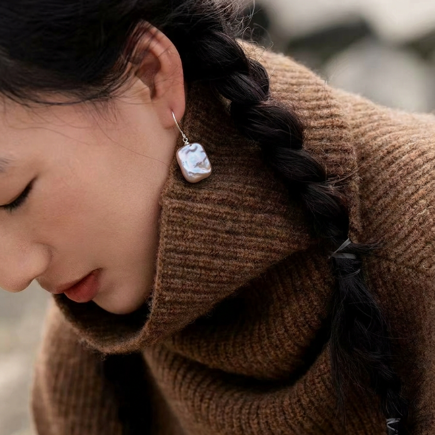 The Lavender Geometric baroque pearl drop earring worn on the ear