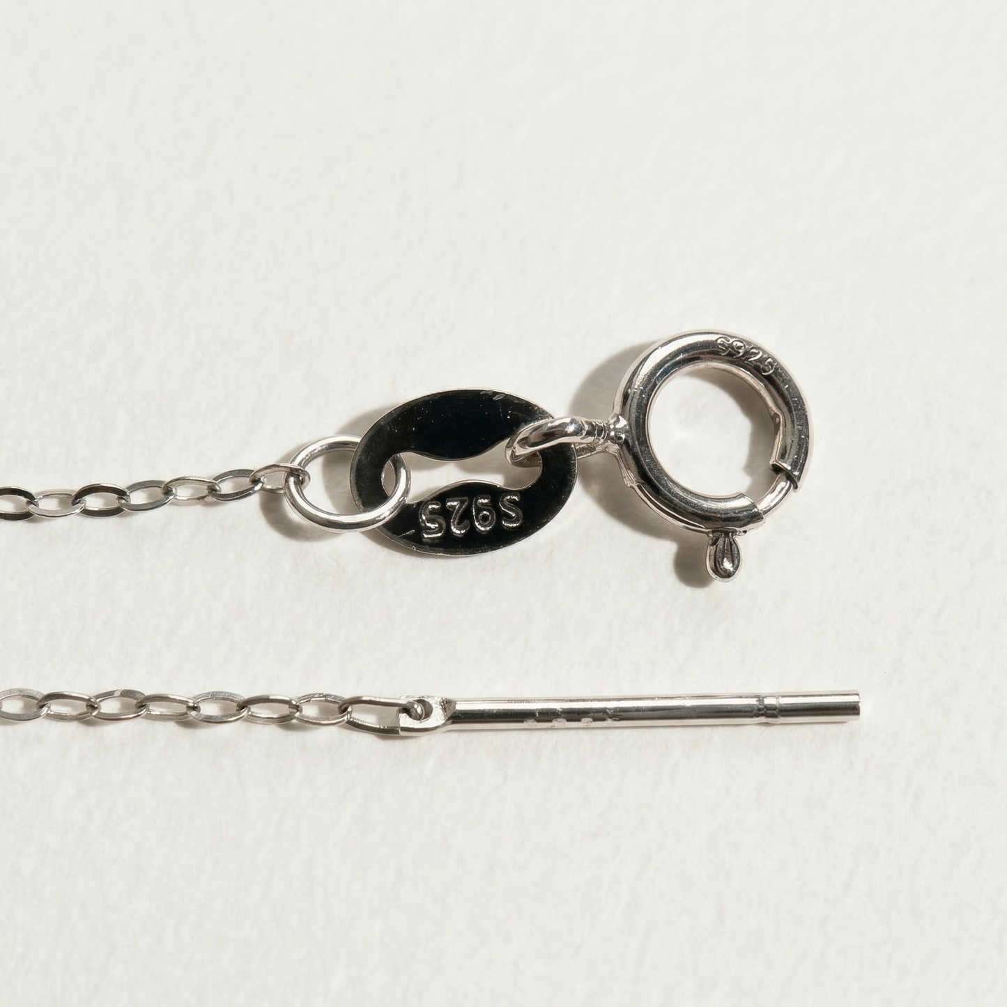 Close-up of The Moondrop button pearl pendant necklace clasp showing the S925 sterling silver chain and fastening detail