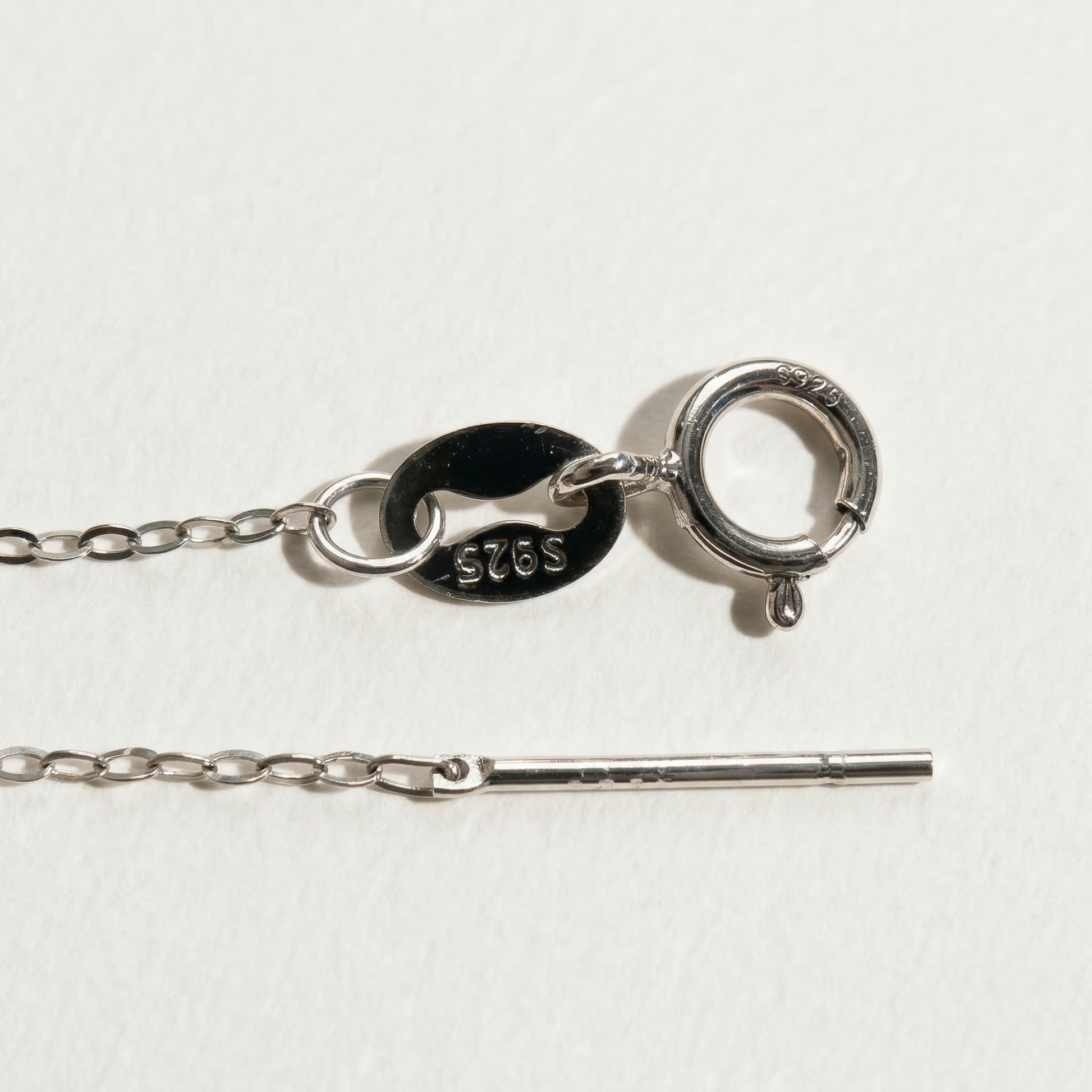 Close-up of The Moondrop button pearl pendant necklace clasp showing the S925 sterling silver chain and fastening detail