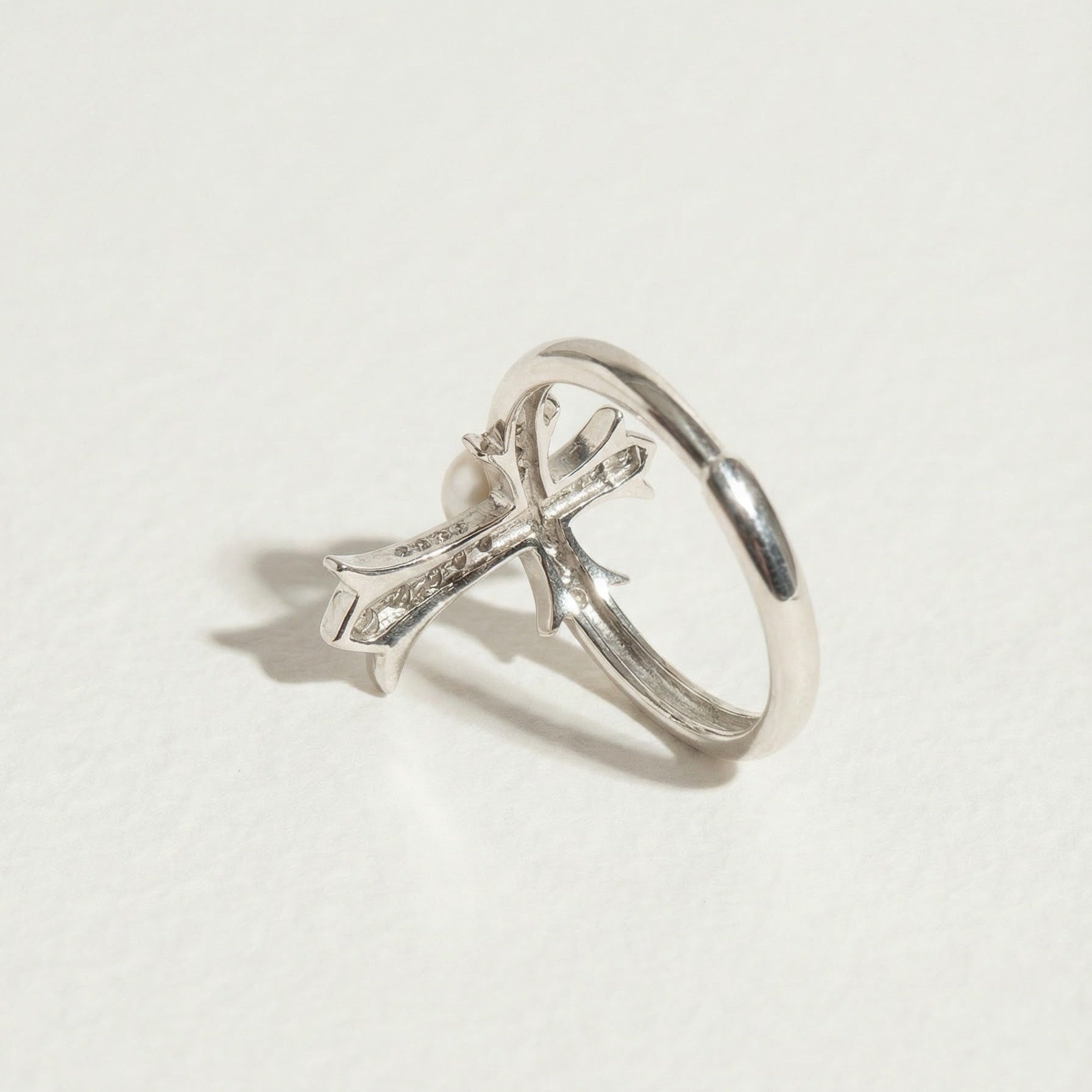 Back detail of The Sacred Glow pearl cross ring showing the underside of the pearl setting and cross structure