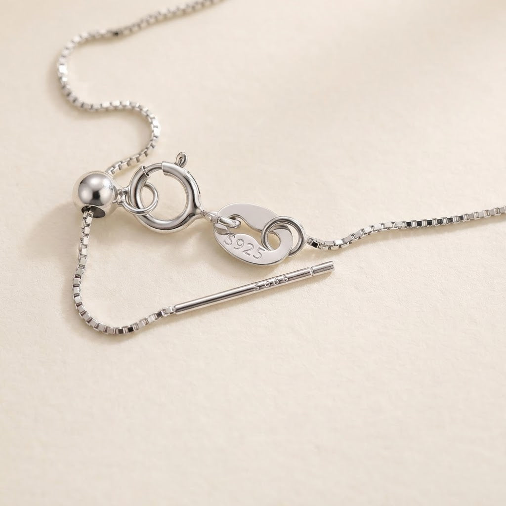 Clasp, sliding adjuster, and 925 sterling silver detail of The Silver Mist grey baroque pearl necklace