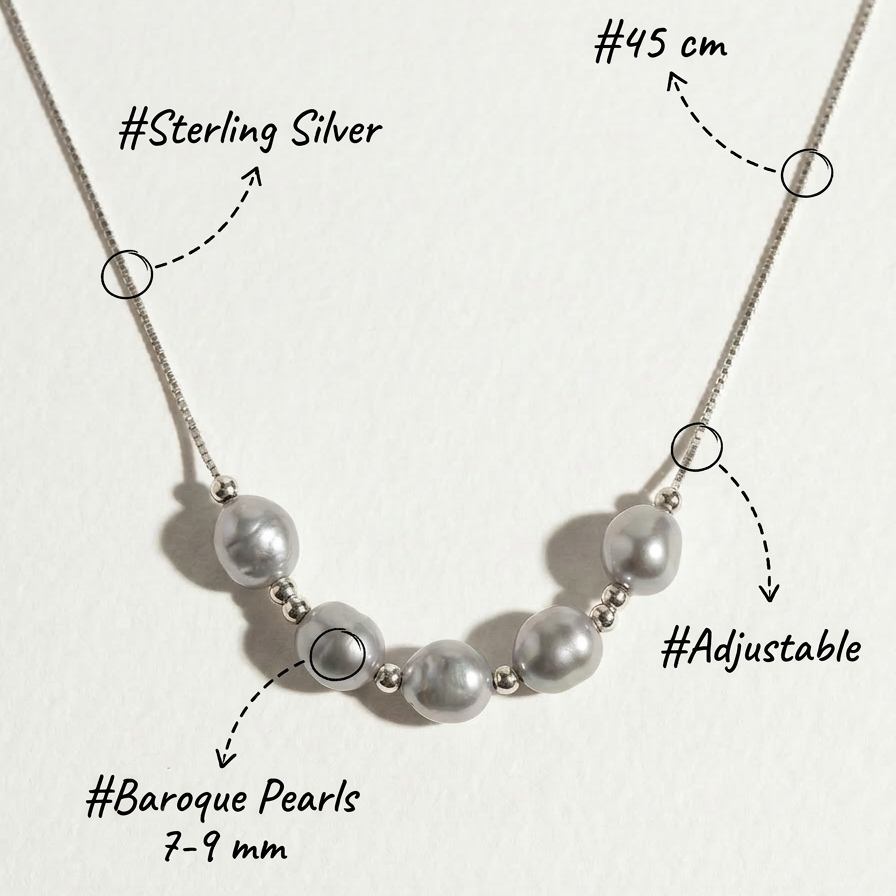 Annotated image of The Silver Mist grey baroque pearl necklace showing sterling silver, 7–9 mm baroque pearls, adjustable design, and 45 cm length