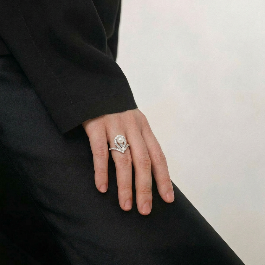 The Sovereign Glow pearl tiara ring worn on the hand