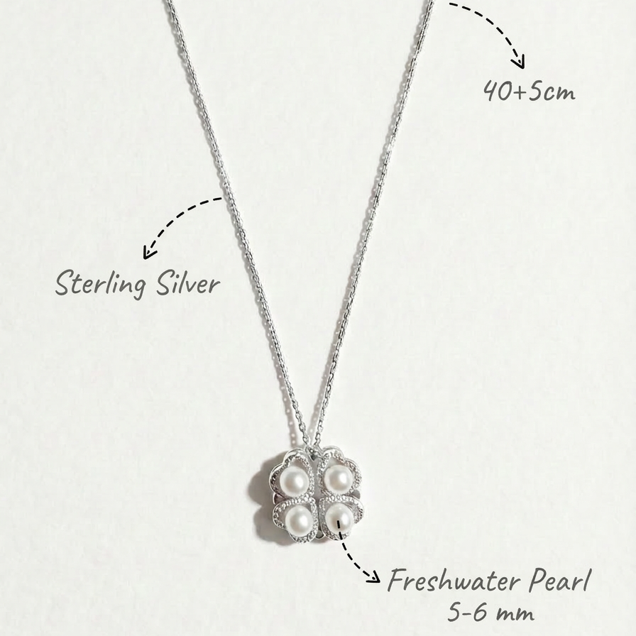 The Turning Heart necklace in sterling silver with four freshwater pearls and size notes on a light grey background